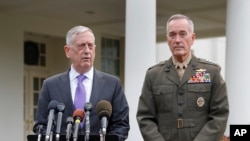 Defense Secretary Jim Mattis, left, accompanied by Joint Chiefs Chairman Gen. Joseph Dunford, right, speaks to members of the media outside the West Wing of the White House in Washington, Sunday, Sept. 3, 2017, regarding the escalating crisis in North Korea's nuclear threats.