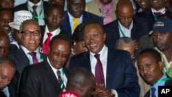 Kenya's President-Elect Uhuru Kenyatta arrives at the the National Election Center where final election results were announced declaring he would be the country's next president, in Nairobi, March 9, 2013. 