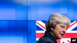 Britain's Prime Minister Theresa May arrives to meet European Council President Donald Tusk at the headquarters in Brussels, Belgium, Feb. 7, 2019. 