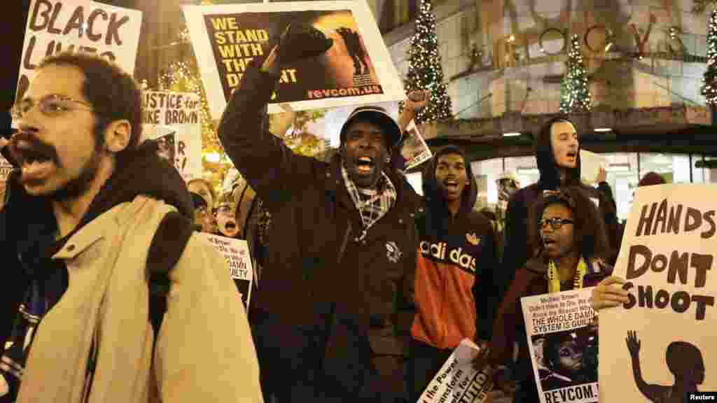 Demonstrators march through the streets following the grand jury decision in the Ferguson, Missouri shooting of Michael Brown, in Seattle, Washington November 24, 2014. The case has highlighted long-standing racial tensions not just in predominantly black