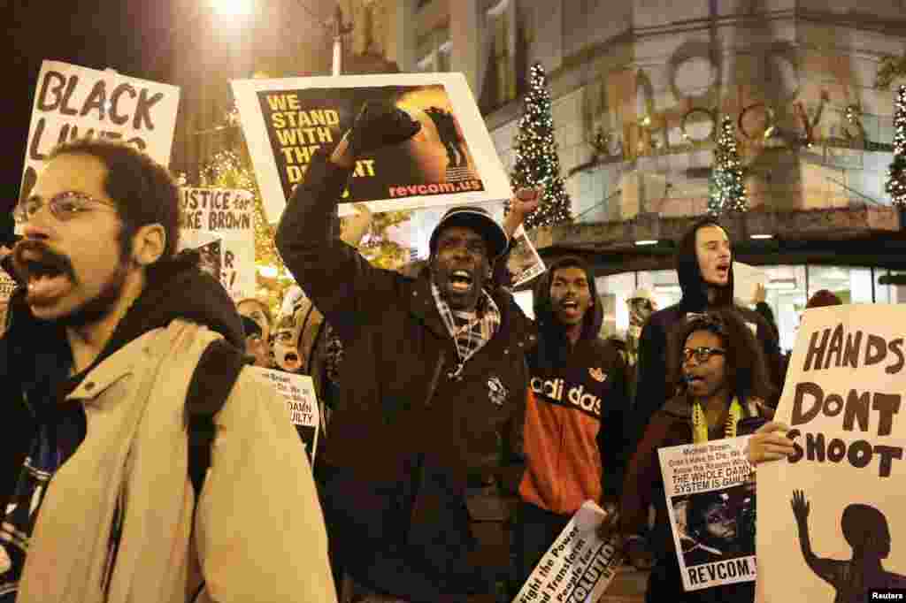 Demonstrators march through the streets following the grand jury decision in the fatal shooting of Michael Brown, in Seattle, Washington, Nov. 24, 2014.