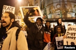 Demonstrators march through the streets following the grand jury decision in the Ferguson, Missouri shooting of Michael Brown, in Seattle, Washington November 24, 2014.