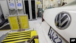 FILE - A 2013 Volkswagen Passat with a diesel engine is evaluated at the California Air Resources Board emissions test lab in El Monte, Calif. 