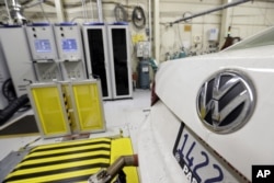 FILE - A 2013 Volkswagen Passat with a diesel engine is evaluated at the California Air Resources Board emissions test lab in El Monte, Calif.