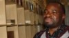 Music historian Evans Netshivhambe inside the archives of the Southern African Music Rights Organization in Johannesburg. He says he's not shocked that gospel is the most listened to music genre in the country. (Darren Taylor for VOA News)
