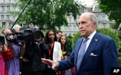 FILE - White House National Economic Council Director Larry Kudlow speaks with reporters at the White House in Washington, June 27, 2018.