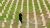 FILE - An Iraqi Kurd resident visits the cemetery for victims of the 1988 chemical attack in the Kurdish town of Halabja, near Sulaimaniya, 260 km (160 miles) northeast of Baghdad, March 16, 2014.