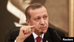 FILE - Turkey's Prime Minister Recep Tayyip Erdogan talks to the media in Istanbul.