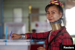 FILE - An ethnic Kayan woman, also known as a long neck villager casts her vote for the general election in Mae Hong Son, Thailand, March 24, 2019. (REUTERS/Ann Wang)