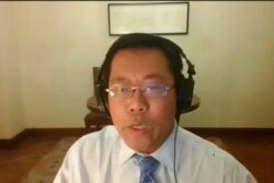 In this image taken from video footage of an online press conference by Human Rights Watch on AP Video, Teng Biao, visiting professor at the University of Chicago, speaks about the upcoming Beijing 2022 Winter Olympics, Jan. 28, 2022.