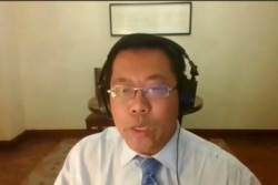 FILE - In this image taken from video footage of an online press conference by Human Rights Watch on AP Video, Teng Biao, visiting professor at the University of Chicago, speaks about Beijing 2022 Winter Olympics, Jan. 28, 2022.