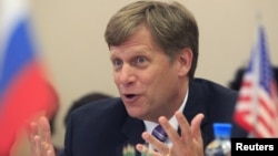 U.S. Ambassador to Russia Michael McFaul gestures during his meeting with deputies of the United Russia party at Russia's State Duma, lower house of parliament, in Moscow, May 25, 2012.