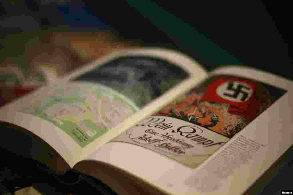 A copy of the book &#39;Hitler, Mein Kampf. A Critical Edition&#39; lies on a display table in a bookshop in Munich, Germany. For the first time since Adolf Hitler&#39;s death, Germany is publishing the Nazi leader&#39;s political treatise unleashing a highly charged debate over whether the text is an inflammatory racist diatribe or a useful educational tool.