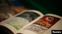 FILE - A copy of the book "Hitler, Mein Kampf. A Critical Edition" lies on a display table in a bookshop in Munich, Germany, Jan. 8, 2016. 