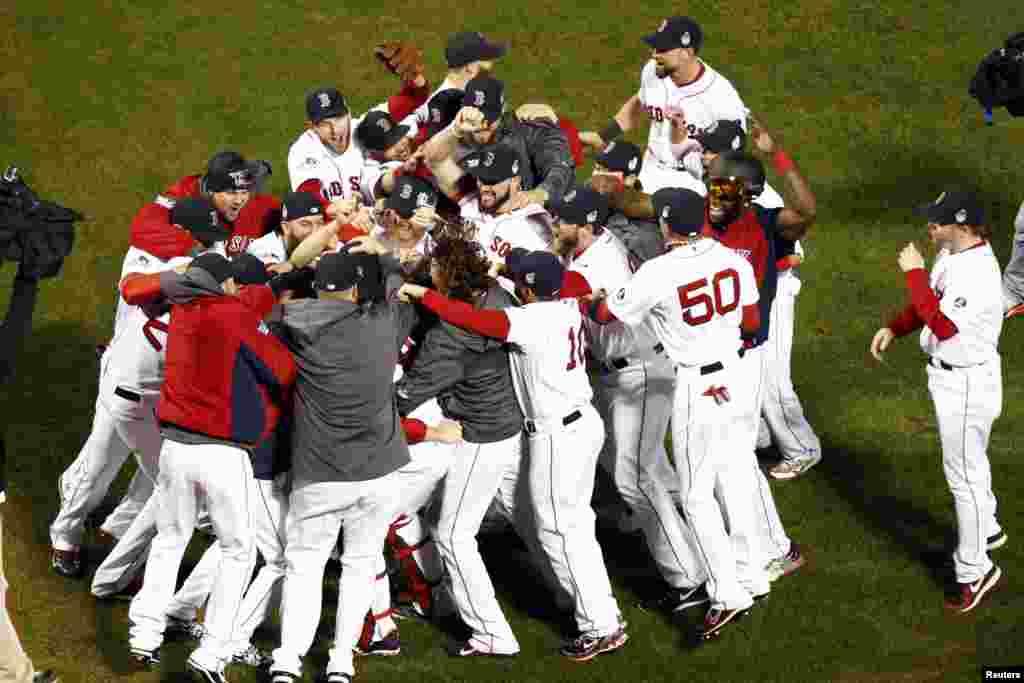 The Boston Red Sox react after defeating the St. Louis Cardinals in game six of the MLB baseball World Series at Fenway Park. Red Sox won 6-1. Mandatory Credit: Mark L. Baer-USA TODAY Sports