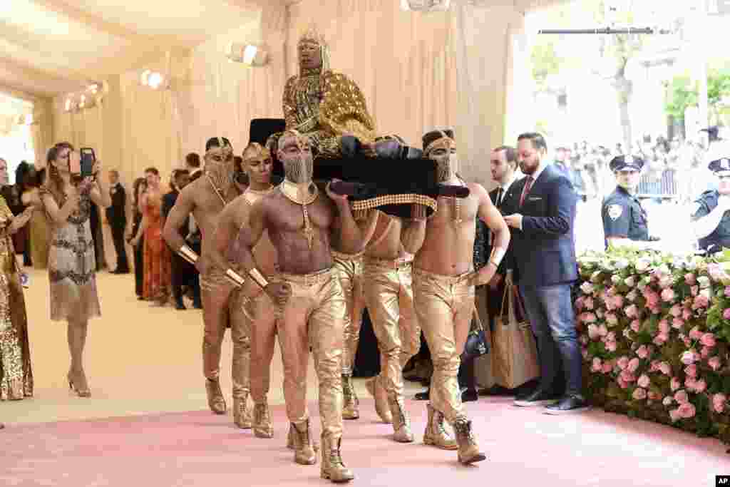 Billy Porter is carried on the red carpet as he arrives at the Metropolitan Museum of Art&#39;s Costume Institute benefit gala in New York, May 6, 2019.