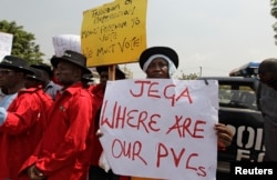 Demonstrators gather at the Independent National Electoral Commission office in Abuja, February 9, 2015.