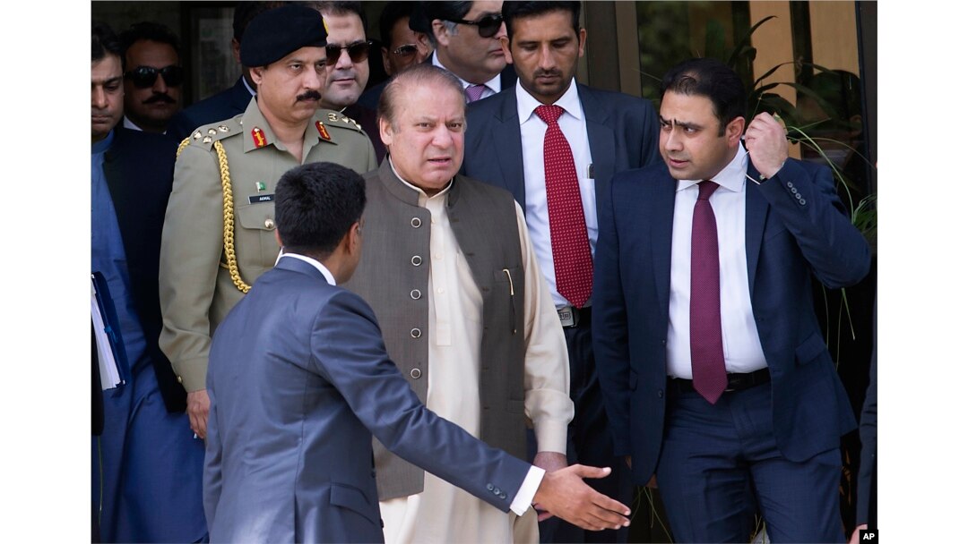 FILE - Pakistani Prime Minister Nawaz Sharif leaves the premises of the Joint Investigation Team, in Islamabad, Pakistan, June 15, 2017.