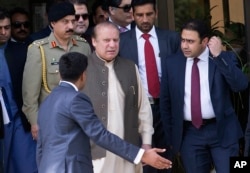 FILE - Pakistani Prime Minister Nawaz Sharif leaves the premises of the Joint Investigation Team, in Islamabad, Pakistan, June 15, 2017.