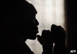 FILE - a former gang member attends a mentoring session at a church in east London, Britain, Aug. 17, 2011. Currently, there are an estimated 200 street gangs across London.