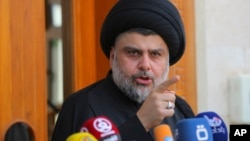 Sh'iite cleric Moqtada al-Sadr speaks during a media conference in Najaf, Iraq, 160 kilometers south of Baghdad, April 30, 2016. Hundreds of Sadr's supporters have been holoding anti-government protests.