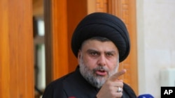 FILE - Shi'ite cleric Muqtada al-Sadr speaks during a media conference in Najaf, Iraq,160 kilometers south of Baghdad, April 30, 2016. 