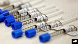 FILE - Syringes filled with the opioid painkiller fentanyl are shown in an inpatient pharmacy, June 1, 2018. 