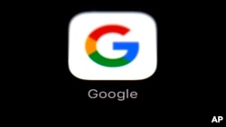 FILE - The Google app is shown on an iPad in Baltimore, March 19, 2018. 