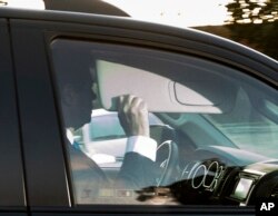 Former Trump Campaign Chairman Paul Manafort leaves his home in Alexandria, Va., Oct. 30, 2017.