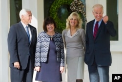 Vice President Joe Biden and Dr. Jill Biden pose for a photograph with Vice President-elect Mike Pence and his wife, Karen, after they had lunch at the Vice President's home at the Naval Observatory in Washington, Nov. 16, 2016.