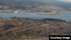 This area of the low-lying peninsula in front of Eureka, California is the proposed location of a tsunami evacuation berm. (Coastal Records Project via Lori Dengler)