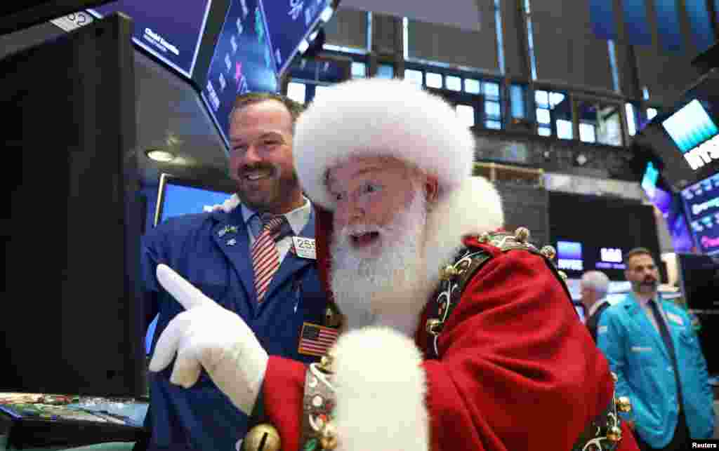 Santa Claus pays a visit to the New York Stock Exchange in New York City on November 21, 2018.