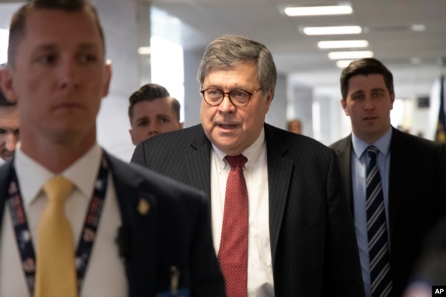 FILE - Since confirmed Attorney General nominee Bill Barr arrives for a meeting on Capitol Hill in Washington, Jan. 26, 2019.