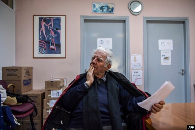 Retired tenor Achilleas Papadopoulos waits to receive his medicines at the social pharmacy of Elliniko, Feb. 27, 2019.