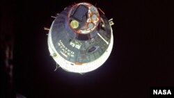 The view after Gemini 6 and 7 made their rendevous shows Germini 7 presparing to return home.