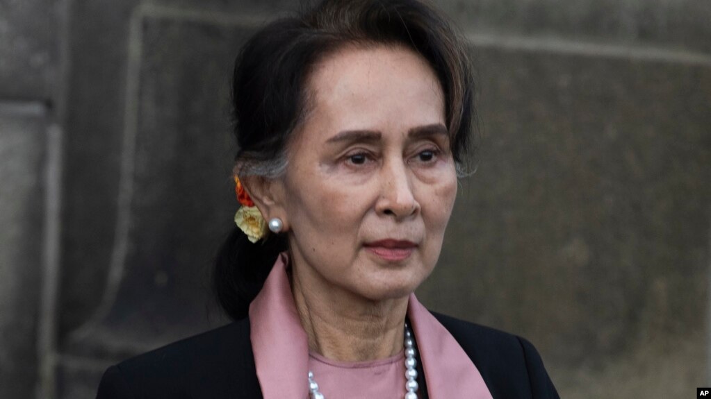 Myanmar's leader Aung San Suu Kyi leaves the International Court of Justice after the first day of three days of hearings in The Hague, Netherlands, on Dec. 10, 2019. (AP Photo/Peter Dejong, File)