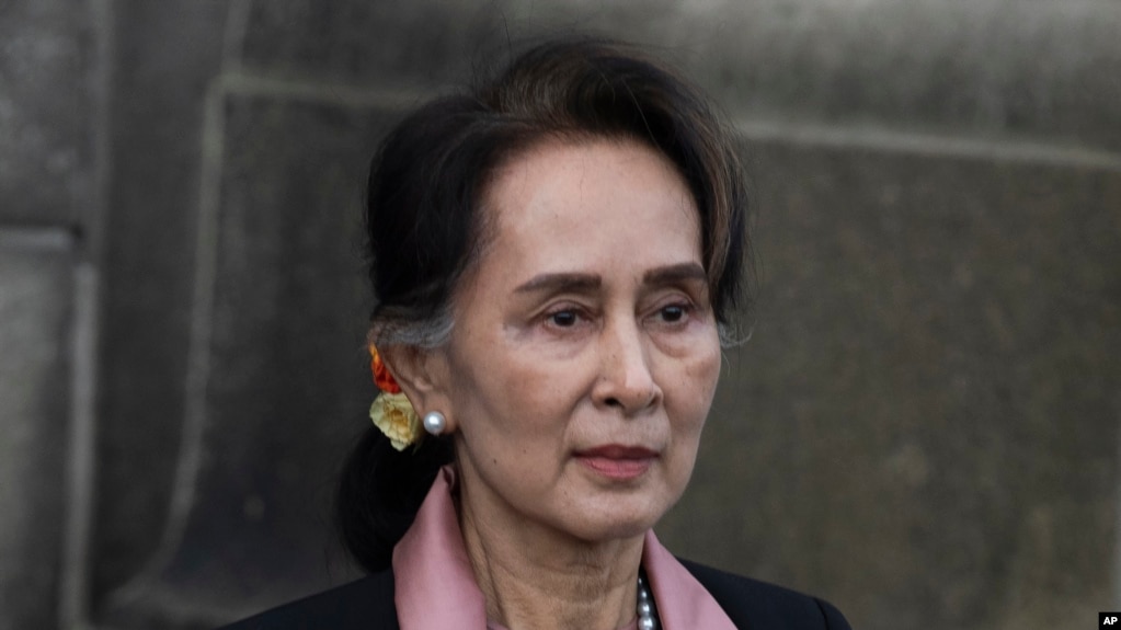 FILE - Myanmar's leader Aung San Suu Kyi leaves the International Court of Justice after the first day of three days of hearings in The Hague, Netherlands, on Dec. 10, 2019. (AP Photo/Peter Dejong, File)