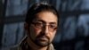 FILE - Massoud Hossaini sits for an interview following a discussion of his Pulitzer Prize-winning photograph at the Newseum in Washington, May 24, 2012. Hossaini, who has been working for the Associated Press in Kabul, said he survived what he called an assassination attempt in Kabul on March 29, 2018. 