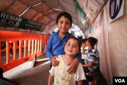 Children at a tent set up by Spanish NGO Remar S.O.S., Athens, Greece, April 16, 2016. (Photo: J. Owens/VOA)