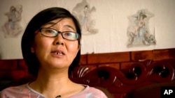 중국의 첫 여성 인권 변호사로 알려진 왕유 씨. 지난 9일 경찰에 연행된 뒤 행방불명됐다. (자료사진)
