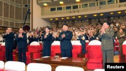 North Korean leader Kim Jong Un (Center) applauds during a demonstration performance by the newly formed Moranbong band in Pyongyang, July 9, 2012