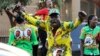 FILE: Supporters of Zimbabwean President Emmerson Mnangagwa celebrate in Harare, Friday, August, 24, 2018. 