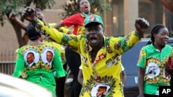 FILE: Supporters of Zimbabwean President Emmerson Mnangagwa celebrate in Harare, Friday, August, 24, 2018. 