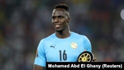 FILE: Senegal's Edouard Mendy celebrates with the goalkeeper of the tournament award after the Africa Cup of Nations final, Yaounde, Cameroon. Taken February 6, 2022