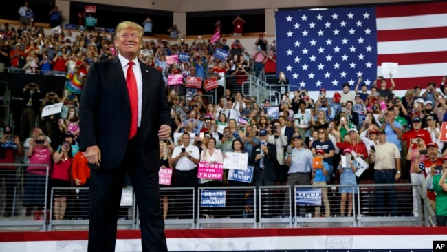 President Donald Trump arrives to speak at a campaign rally at Erie Insurance Arena, Oct. 10, 2018, in Erie, Pa.