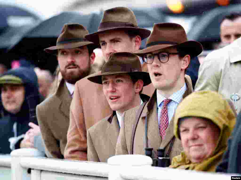 Cheltenham Festival racegoers react to the horse race on the Cheltenham Racecourse, Cheltenham, Britain.