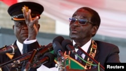Zimbabwe's President Robert Mugabe is seen addressing a crowd in Harare August 12, 2013.