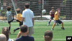 Nine and 10-year-old boys play football in Washington, DCC