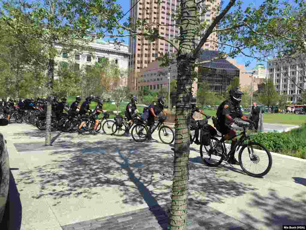 Cleveland police on bicycles move closer to protest going on near the Soldiers and Sailors Monument in Public Square, in Cleveland, July 19, 2016.