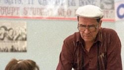 Jaime Escalante talks with a student in his calculus class at Garfield High School in Los Angeles, Cailfornia in 1988.